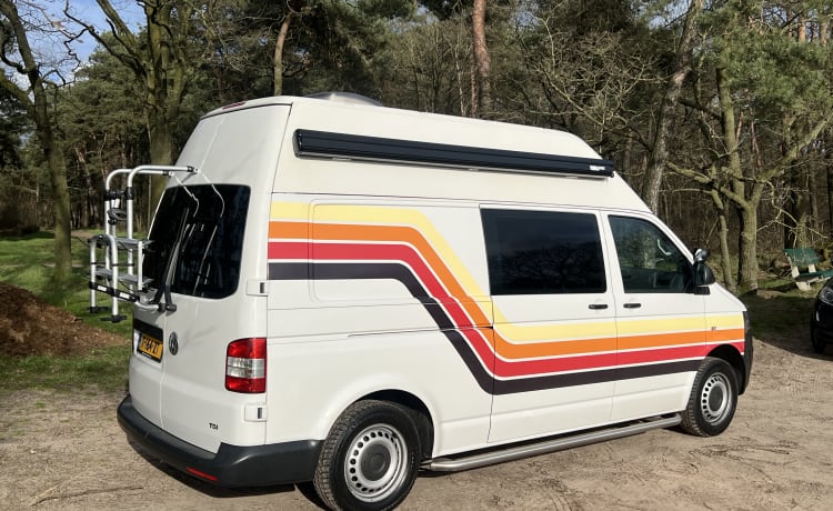 Retro Volkswagen Bus with bicycle carrier & awning