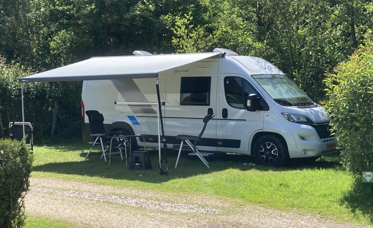 Sunliving Bus camper with bus biker