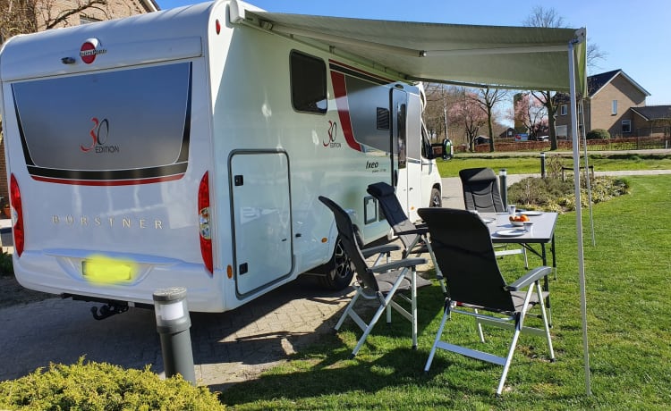 luxury camper including queen-size bed, pull-down bed and large garage and tow bar