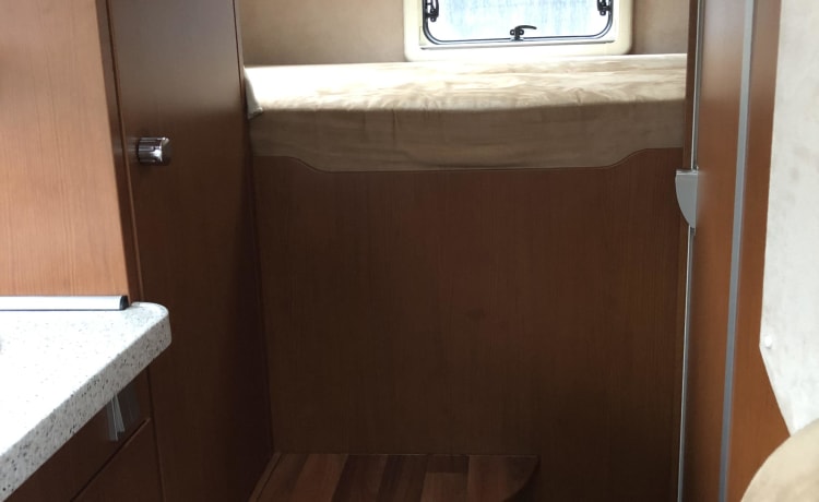 Wonderful luxury 4-person integral camper with plenty of storage space & bicycle carrier.