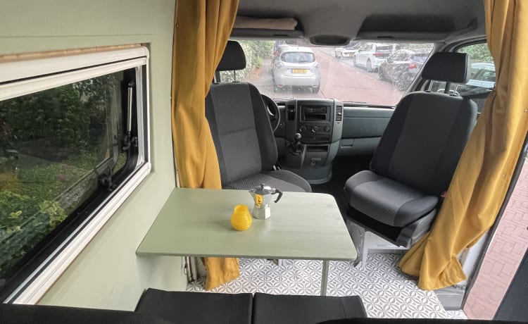 Cozy camper van with fixed bed