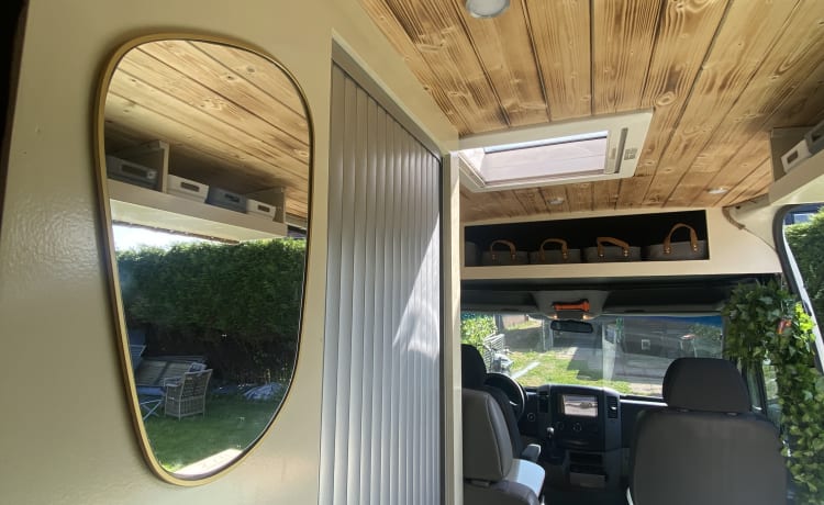 Home is where we park it! – Cool, fresh, self-sufficient 4 person bus camper.