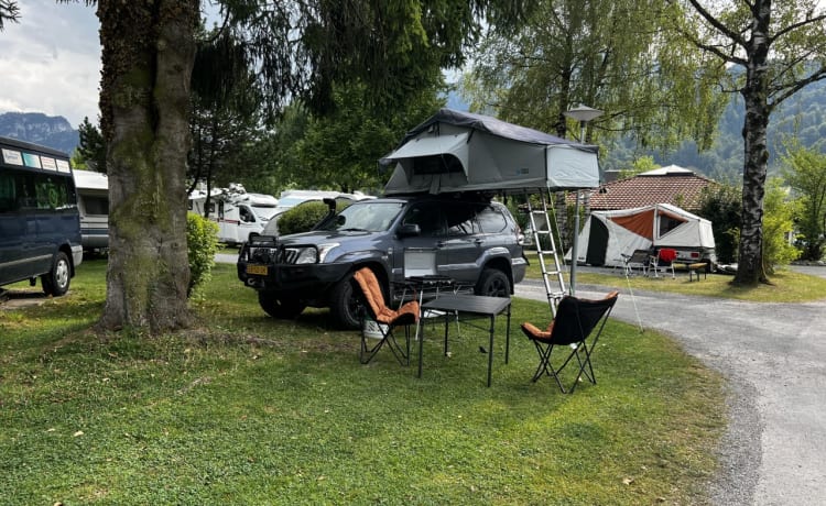 Toyota Land Cruiser 120 with rooftop tent