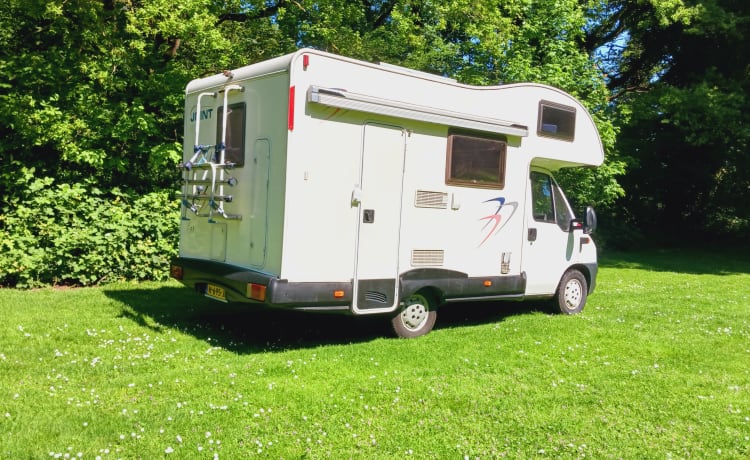 Young and cozy Fiat with bicycle carrier and air conditioning