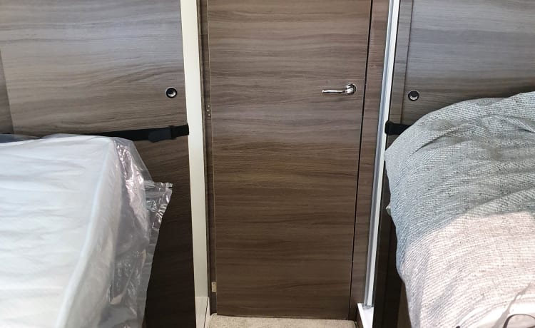 8 – luxury 4 person mclouis Carat 2022 with fixed bed in the back