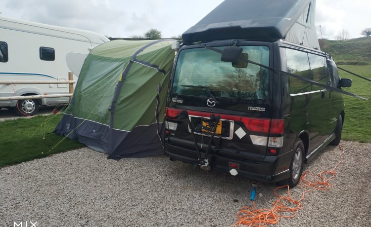 LOCATION DE CONVERSION DE GAZ BONGO AU BÉNÉFICE DANS LA TENTE ET LE PORTA L DE TOILETTES GRATUITES DE STAFFORD