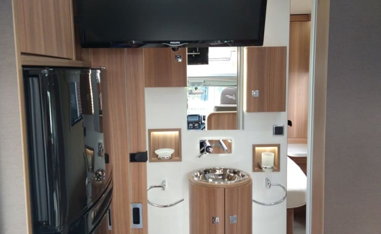 luxury camper for rent Challenger queen bed dish