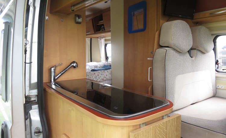 2 person bus camper with fixed bed and sanitary facilities