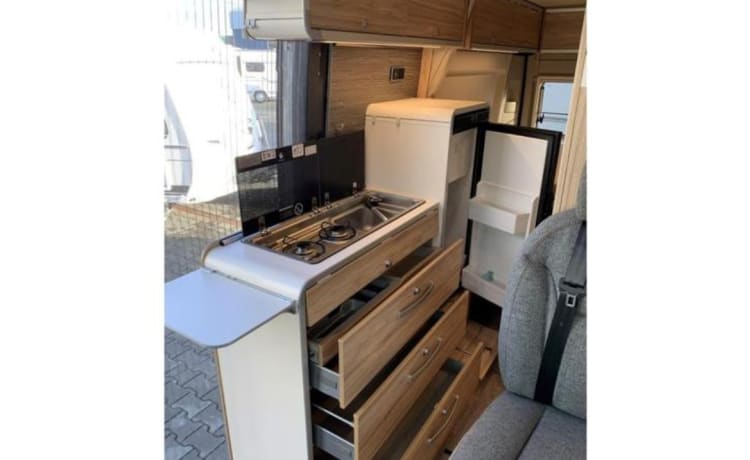 Jo'Berg – Camper autobus Hymer Yellowstone (con tetto sollevabile) del 2019