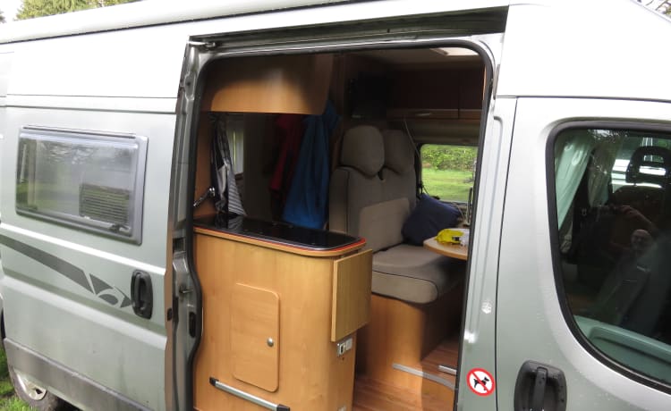 2 person bus camper with fixed bed and sanitary facilities