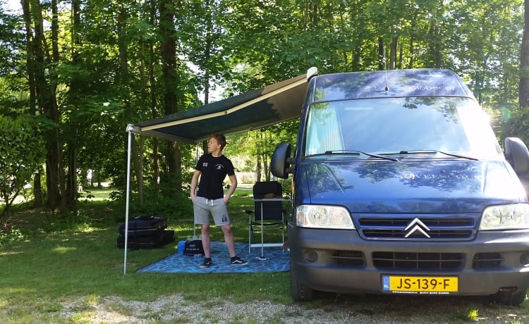 Compact yet spacious factory camper with cozy round seat and winter tires