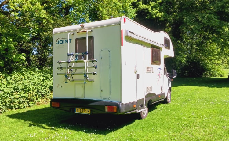 Young and cozy Fiat with bicycle carrier and air conditioning