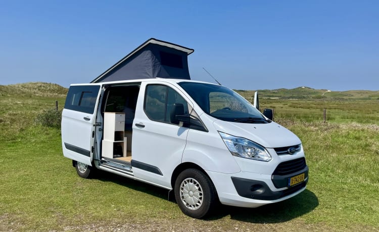 Cosy, compact off-grid Ford camper van