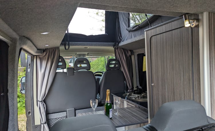 fully comp insurance included –  4 berth pop top  Peugeot campervan with wind out flamma awning