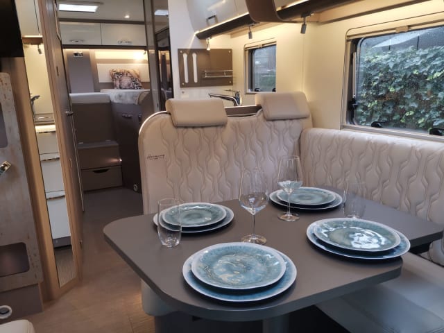 Luxury semi-integrated Burstner camper single beds & pull-down bed