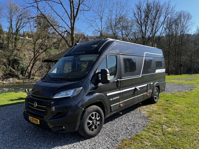 Fiat Adria 640 bus camper with large garage and fold-down bed 