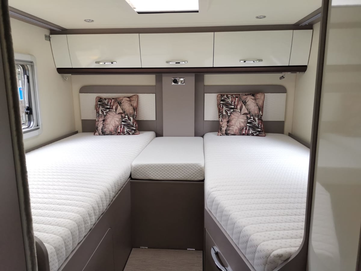 Luxury semiintegrated Burstner camper single beds & pulldown bed from
