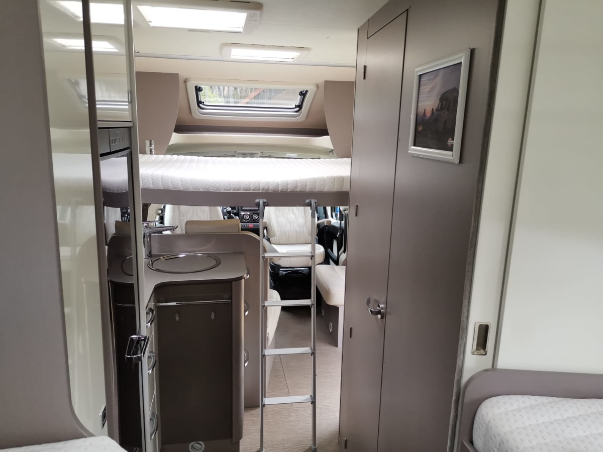 Luxury semiintegrated Burstner camper single beds & pulldown bed from