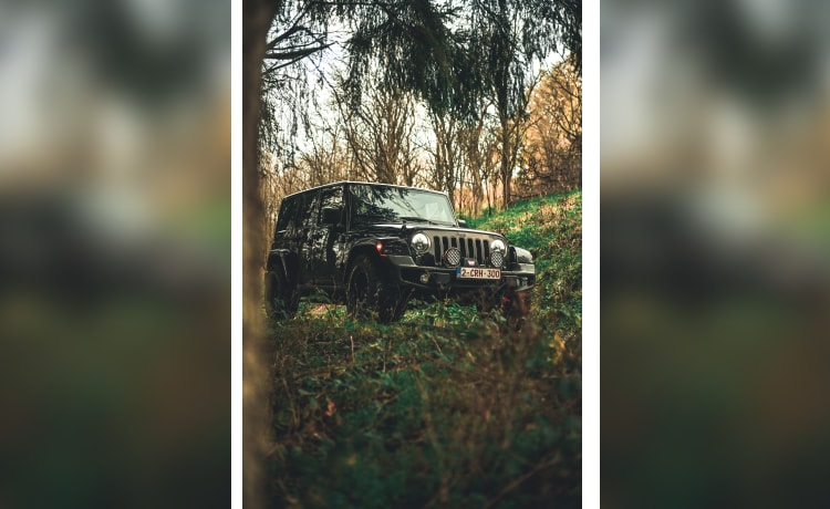 Overland jeep wrangler with equipment. 