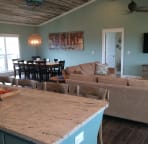 The large dining table easily seats 10 and there is seating for 4 at the kitchen island.