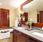 Master Bathroom: A bath tub and dual vanities and a stand-up shower room