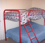 Bedroom #4 has wall-mounted flat screen TV to keep it out of the way of kids