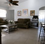 This is the living room, in the back you see the 2nd bathromm and 2 bedrooms next to it, the 3rd you see in the left corner