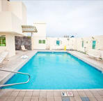 The rooftop pool has a covered entertaining area for your enjoyment.