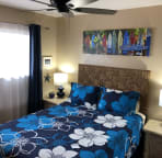 Light and bright guest bedroom with queen bed