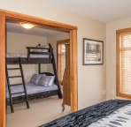 Bedroom 2 & 3 separated by wood pocket doors.