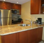 Your gourmet kitchen with stunning upgraded granite counter and cherry wood cabinets