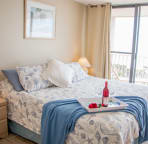 Ocean Front Master Bedroom, king bed, flat screen tv, and tile floors