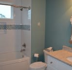 The first floor bathroom is shared by the bunk room and the third bedroom.