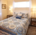 Queen bedroom upstairs with smart tv