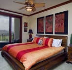 Master Bedroom with golf course views from its lanai. King size bed