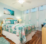 Soothing island colors. Queen bed with memory foam topper.