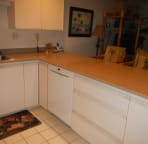 Large kitchen with built-in quiet Bosch dishwasher.
