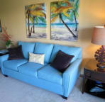 Brand new modern styled sleeper sofa, end tables, art work