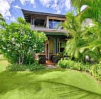 Back view of villa and plumeria tree on a typical sunny day on the Big Island.