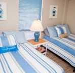 2nd bedroom has 2 full size beds, flat screen tv and tile floors