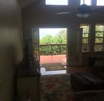 view out the open deck doors from living room