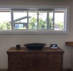 entry window with teak dresser