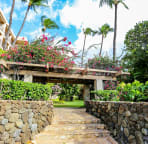 The grounds are a tropical paradise with fragrant flowers and level lawns.