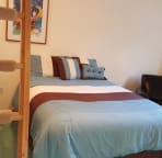 Typical suite with queen bed on main level and lofts above.