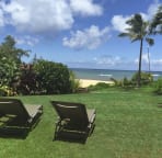 Sit on our lawn and sun bathe while watching the sea and sand and your kids.