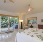 Downstairs master bedroom with full bath and sliding doors to the beach.
