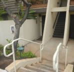 Four steps down to front door on left