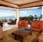 Living room and spacious corner unit deck and panoramic ocean view