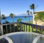 private lanai with lounge chair and swivel barstools and table