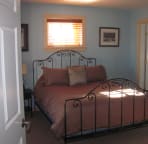 The other lower level guest room has a queen size bed